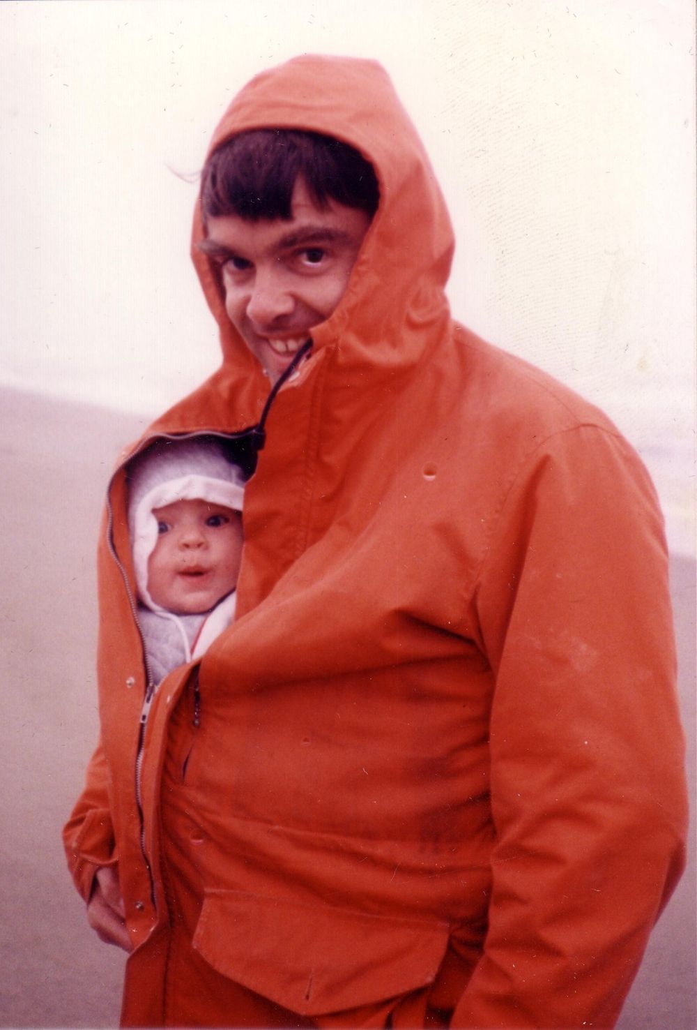 Bundled up on a foggy beach